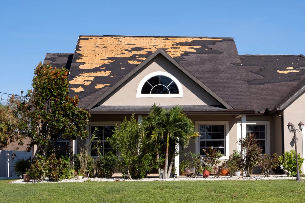 Consequences,Of,Natural,Disaster.,Damaged,House,Roof,With,Missing,Shingles