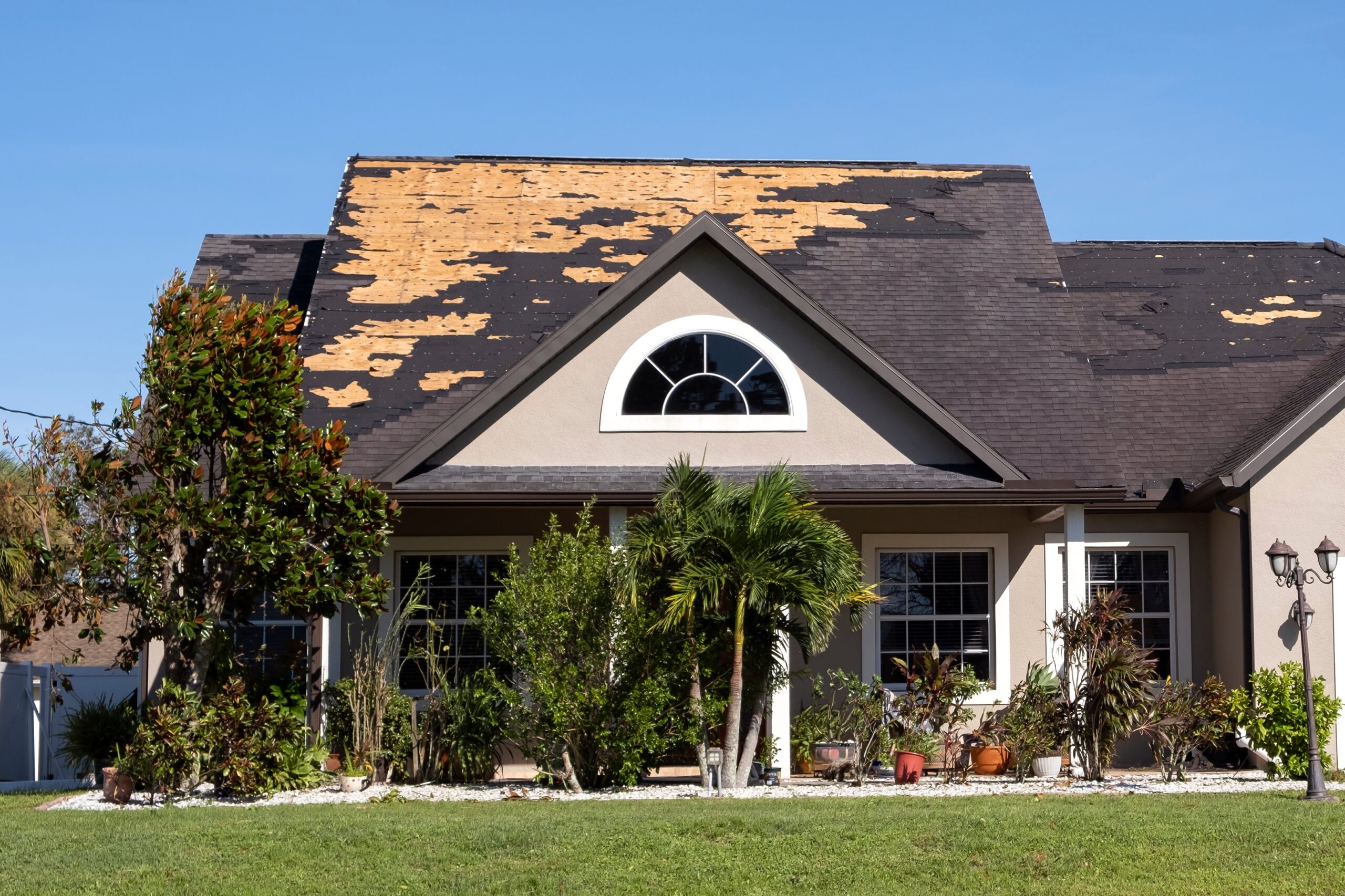 Consequences,Of,Natural,Disaster.,Damaged,House,Roof,With,Missing,Shingles