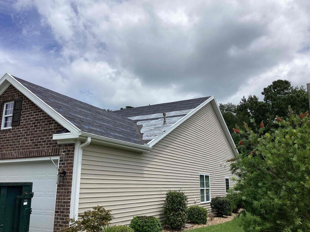 Salty Dog Roofing & Siding roof repair project showing storm-damaged roofing materials being repaired on a residential home in South Carolina
